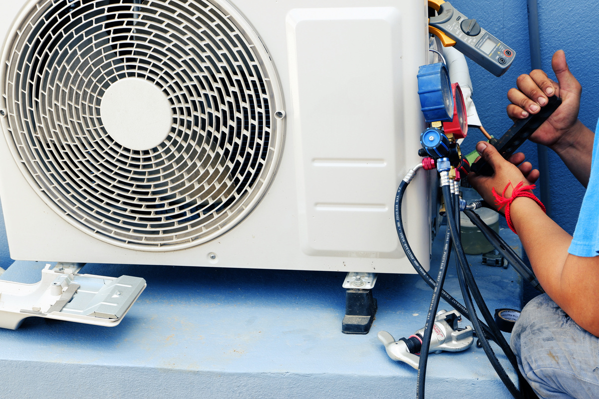 Air Conditioning Technician Is Repairing Air Conditioner